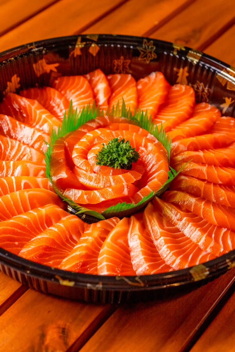 A Skinny Sushi salmon sashimi platter arranged for sharing